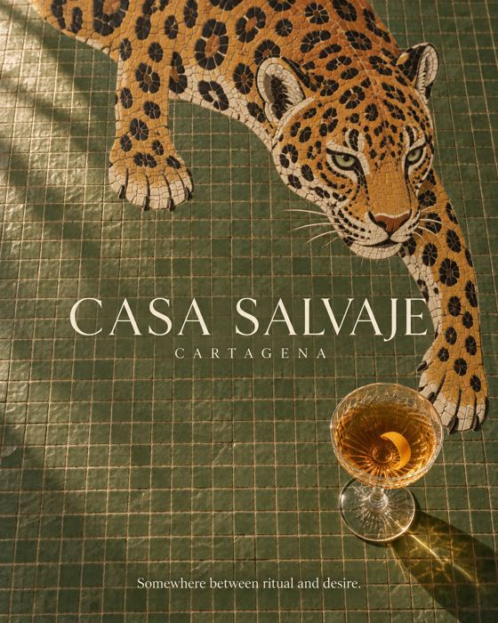 Poster: a mosaic jaguar on green tiles reaching for a cocktail glass. Text: "Casa Salvaje. Cartagena. Somewhere between ritual and desire."